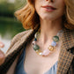 Noonday Iris glass necklace on model, close up