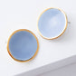 Noonday Halo porcelain stud earrings in light blue with gold rim