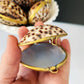 Tiger cowrie shell trinket box opened in hand