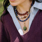 Noonday Kika necklace layered on model