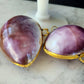 Purple cowrie shell trinket box on marble